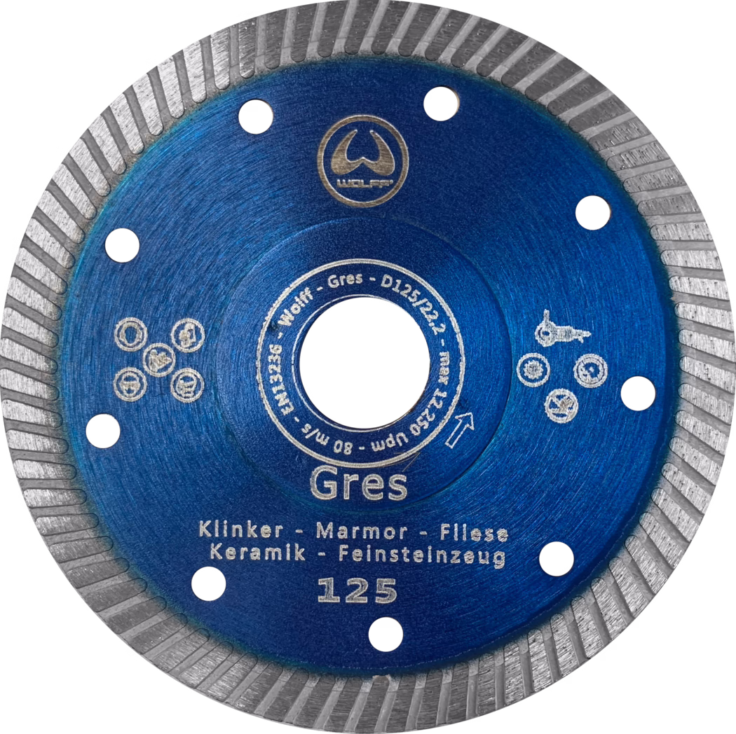 Gros plan d'un disque de coupe diamanté circulaire bleu avec un bord argenté segmenté, plusieurs trous d'aération et des inscriptions blanches comprenant 'Gres' et '125', destiné à la coupe de céramique, marbre et carrelage.